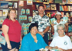 Several co-workers and friends join Mary at her first booksigning for "All Keyed Up," one of her romance novels. Several co-workers and friends helped make her first booksigning for All Keyed Up a success in the Upper Keys in July 2004. Pictured  (l-r) are Lori, Paul, Susan and Dea.